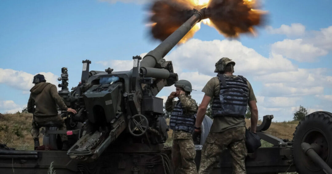Ukrainian troops fire artillery during the Russian invasion of the Ukrainian region of Donbass.
